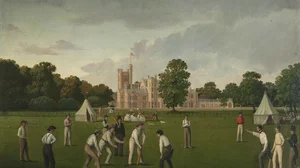 Ein Cricketspiel mit Canford Manor im Hintergrund