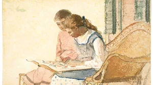 Two Girls Looking at a Book