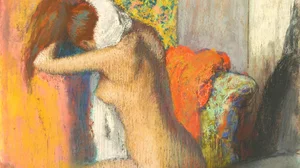 After a Bath. Woman Drying the Back of her Neck.