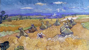 Wheatfield with sheaves and reaper