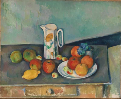 Still life with milk pot and fruits on a table