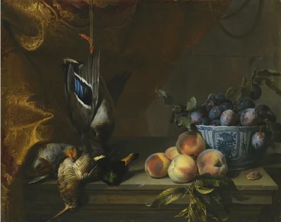 Still life of plums in a blue and white porcelain bowl
